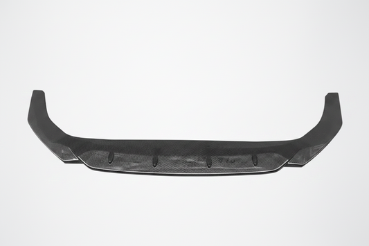 A carbon fiber rear bumper lip spoiler with a carbon fiber weave pattern, shown against a light gray background with a faint graphic outline of two mounting brackets above it.